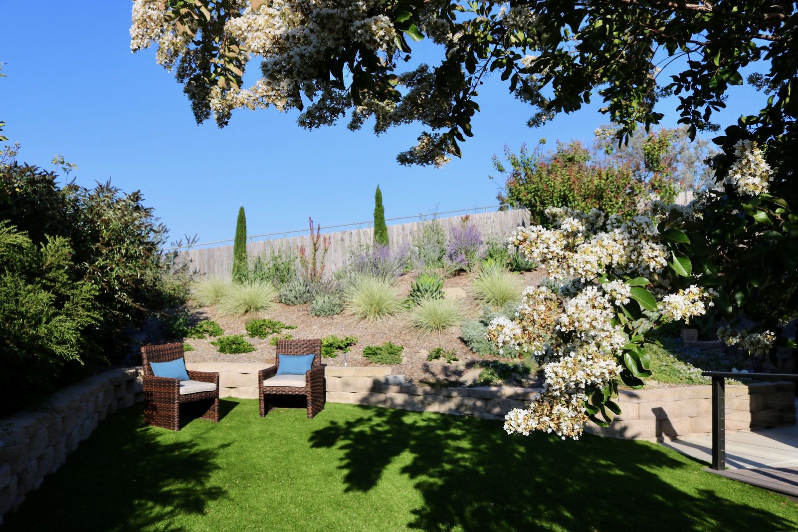 Back garden with plantings and quiet seating
