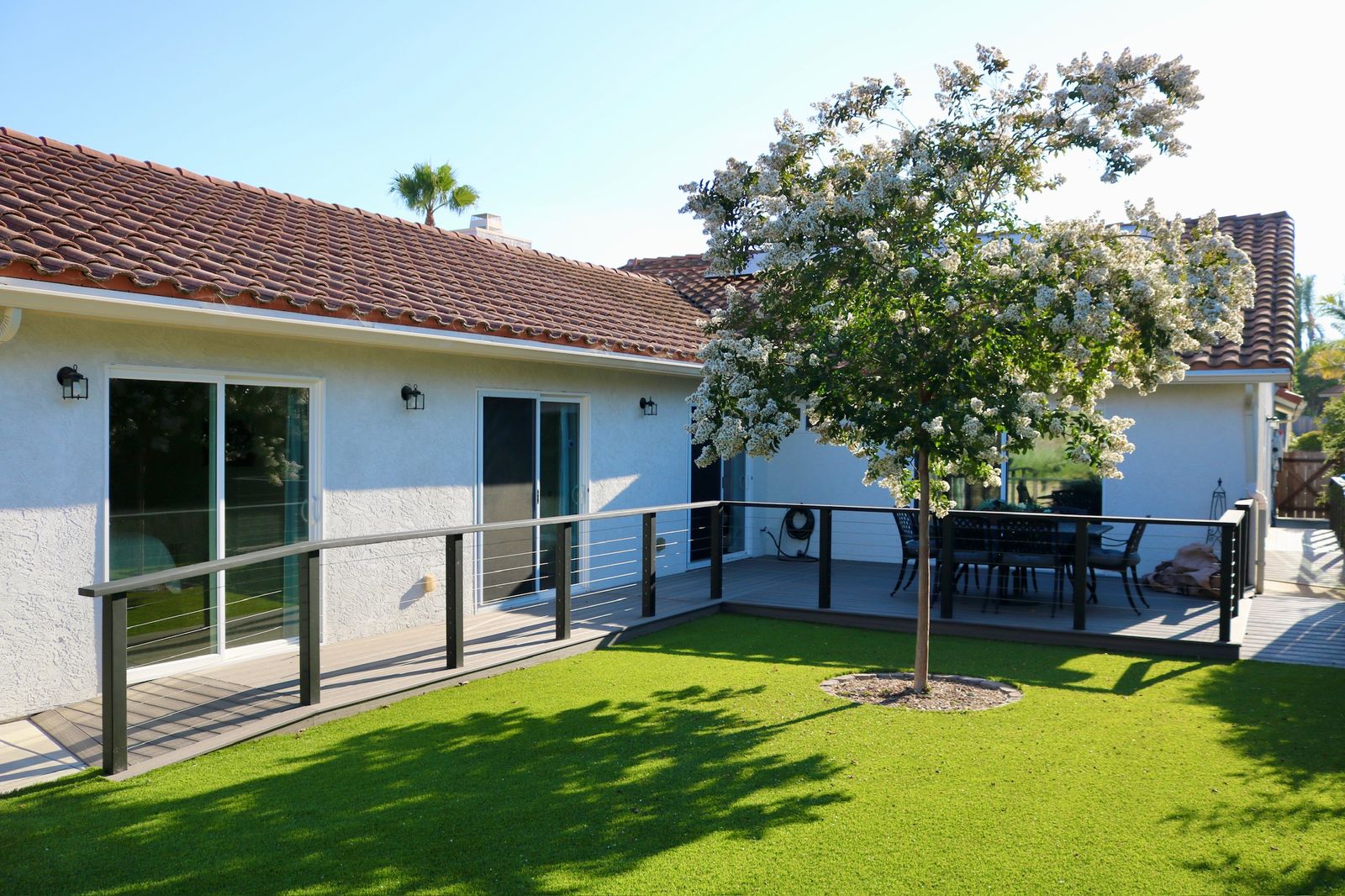 Landscaped backyard and lawn at Olive Tree Elderly Homes in Oceanside
