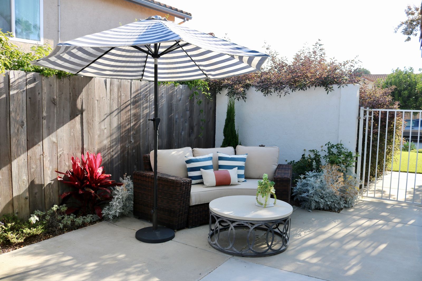 Side patio with landscaping and walkway