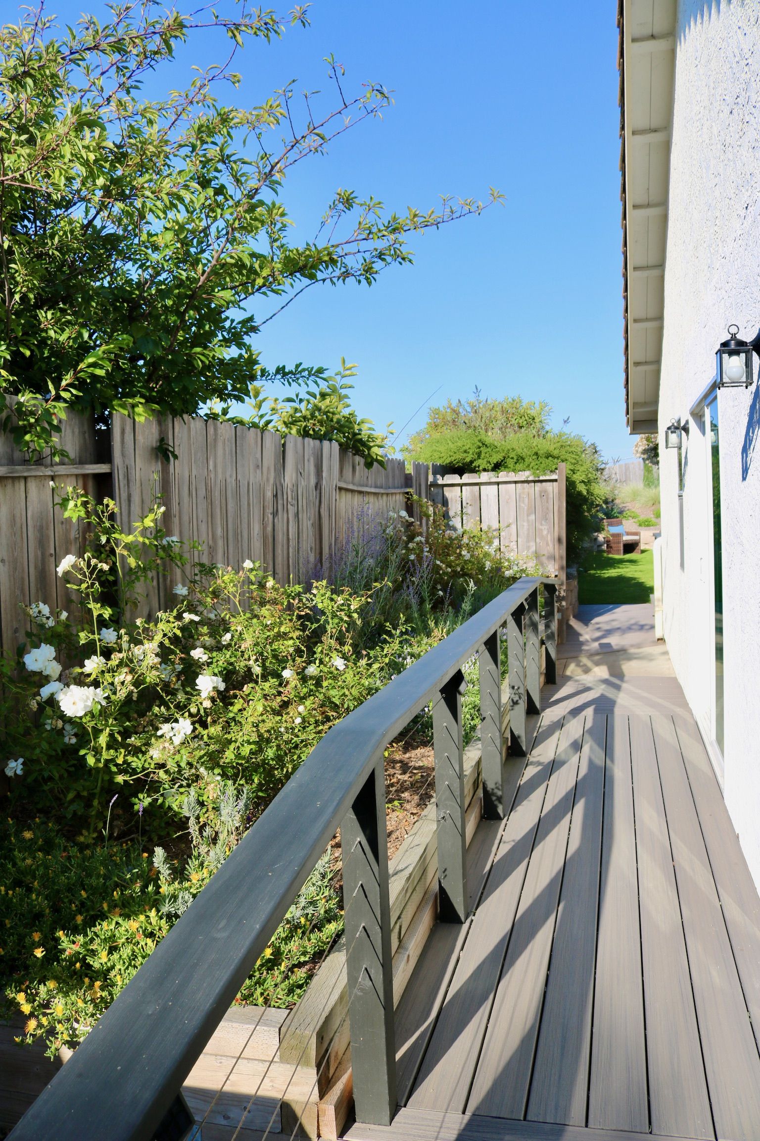 Garden walkway lined with sturdy safety rails for confident strolls